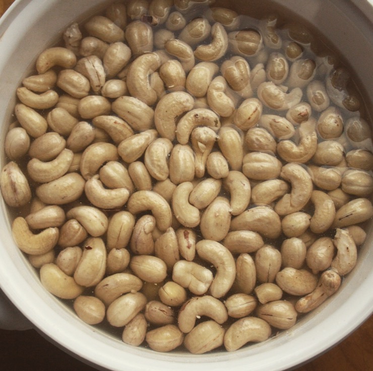 Cashews soaking in a bowl for a cashew sauce base recipe