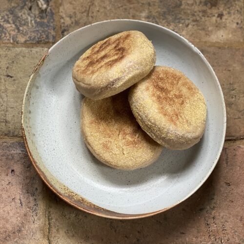 a plate with three spelt english breakfast muffins