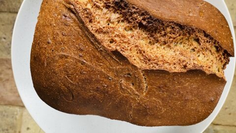 vegan spelt bread loaf on a plate