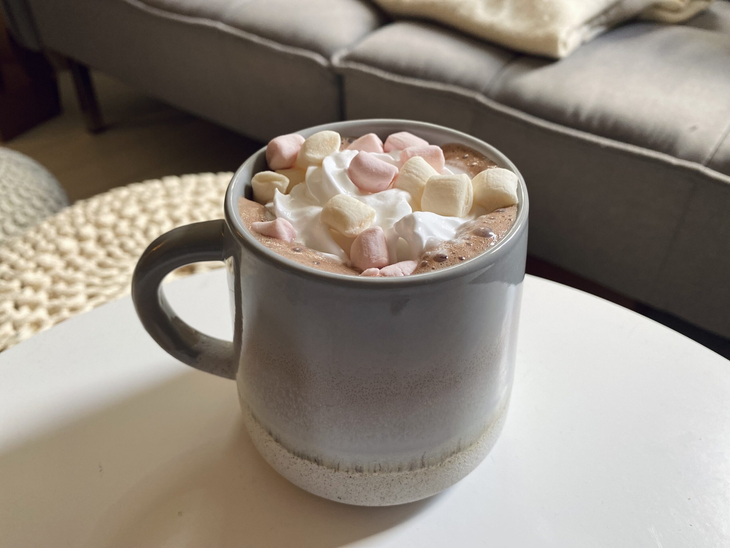 vegan hot chocolate with vegan whipped cream and marshmallows