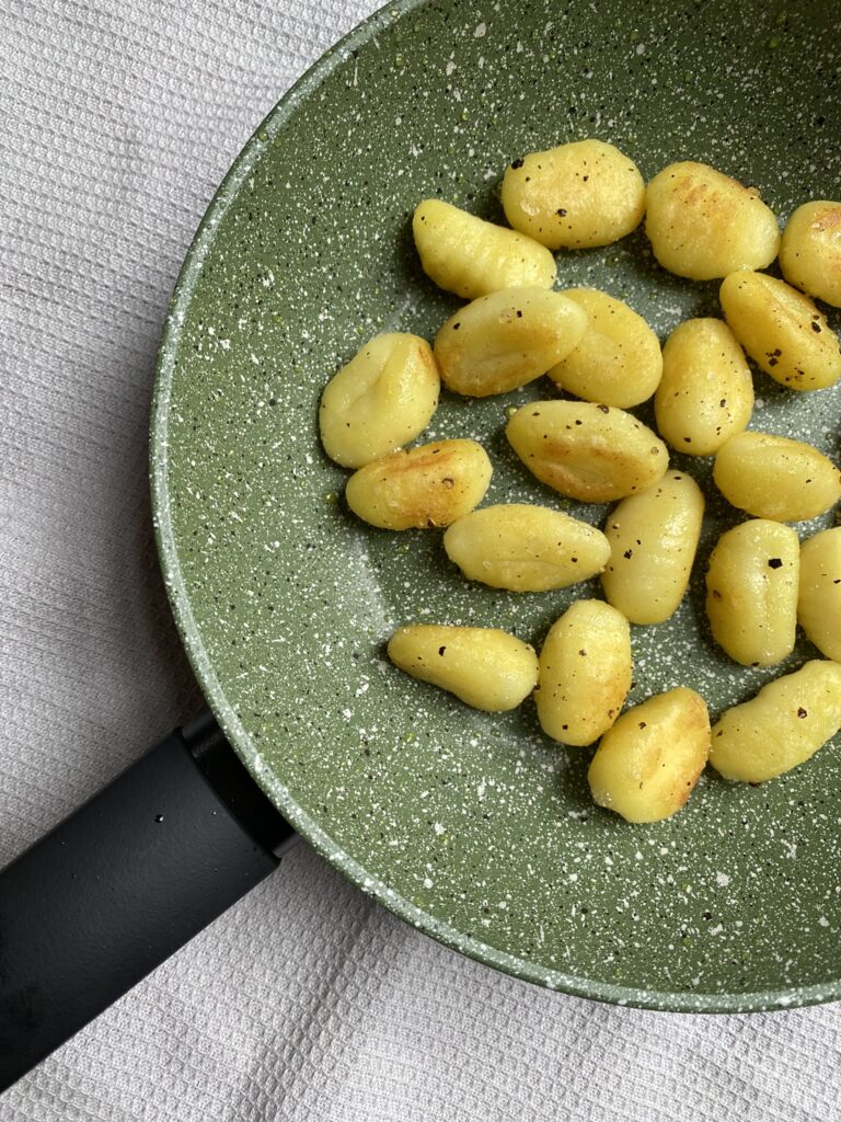 Close up of gnocchi cooked in Prestige eco frying pan