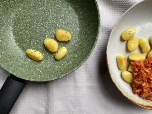 Prestige eco frying pan with cooked gnocchi