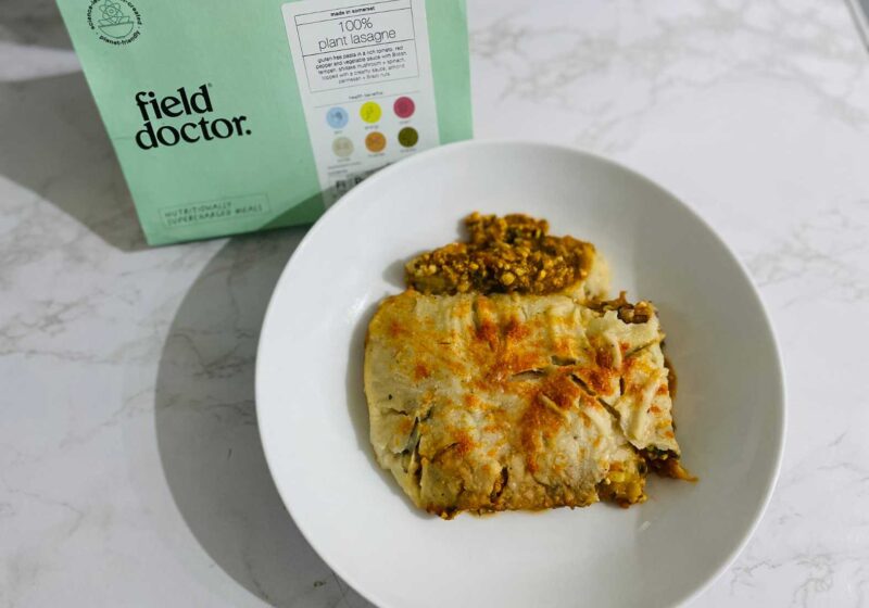 A bowl with a cooked plant based lasagne on it from Field Doctor a vegan ready meal