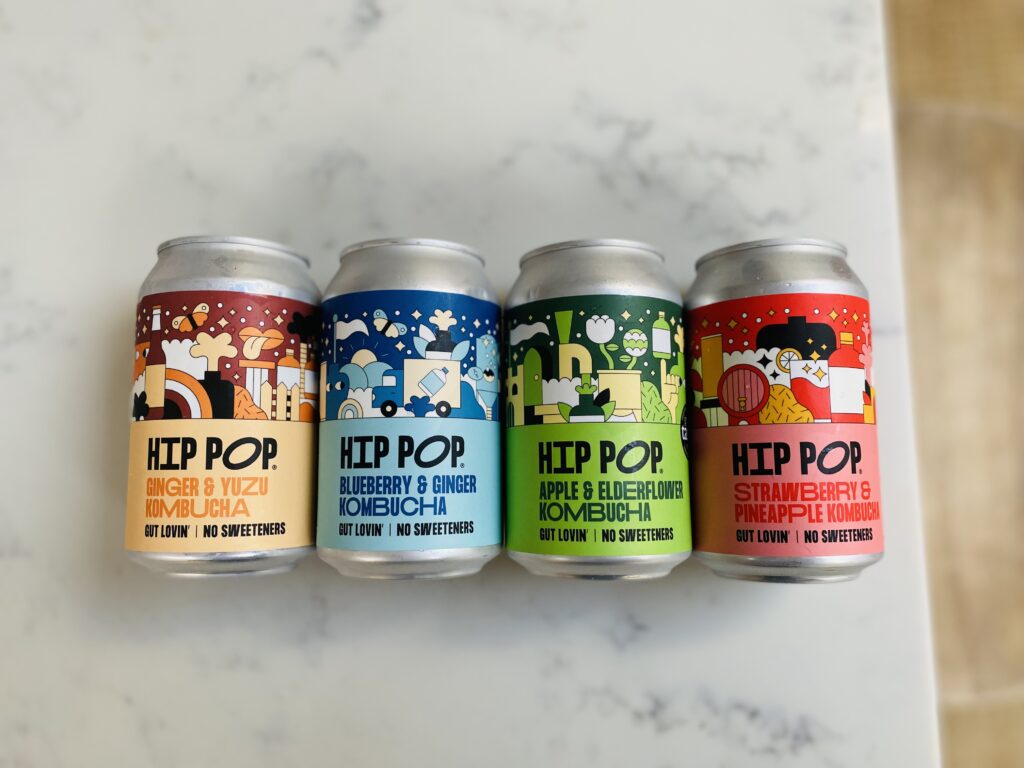 A close up of Hip Pop's kombucha drinks on a marble worktop