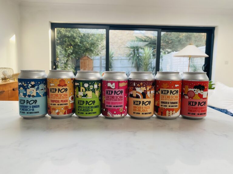 A row of Hip Pop fizzy drinks lined up on a marble worktop