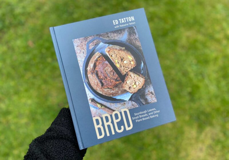 The BReD cookbook by Ed Tatton in front of the grass
