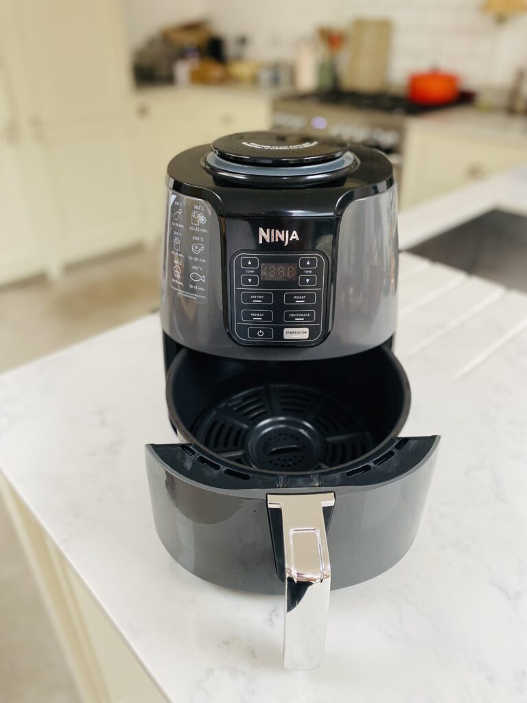 The Ninja Air Fryer with its frying drawer open