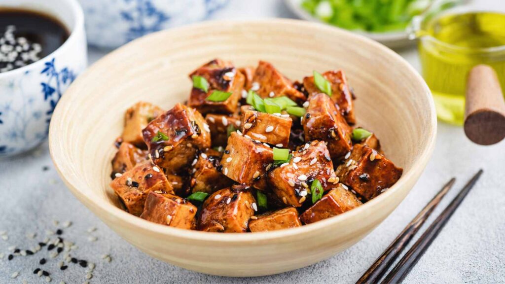 Fried tofu cooked in Asian sauces true to historical Asian cuisines