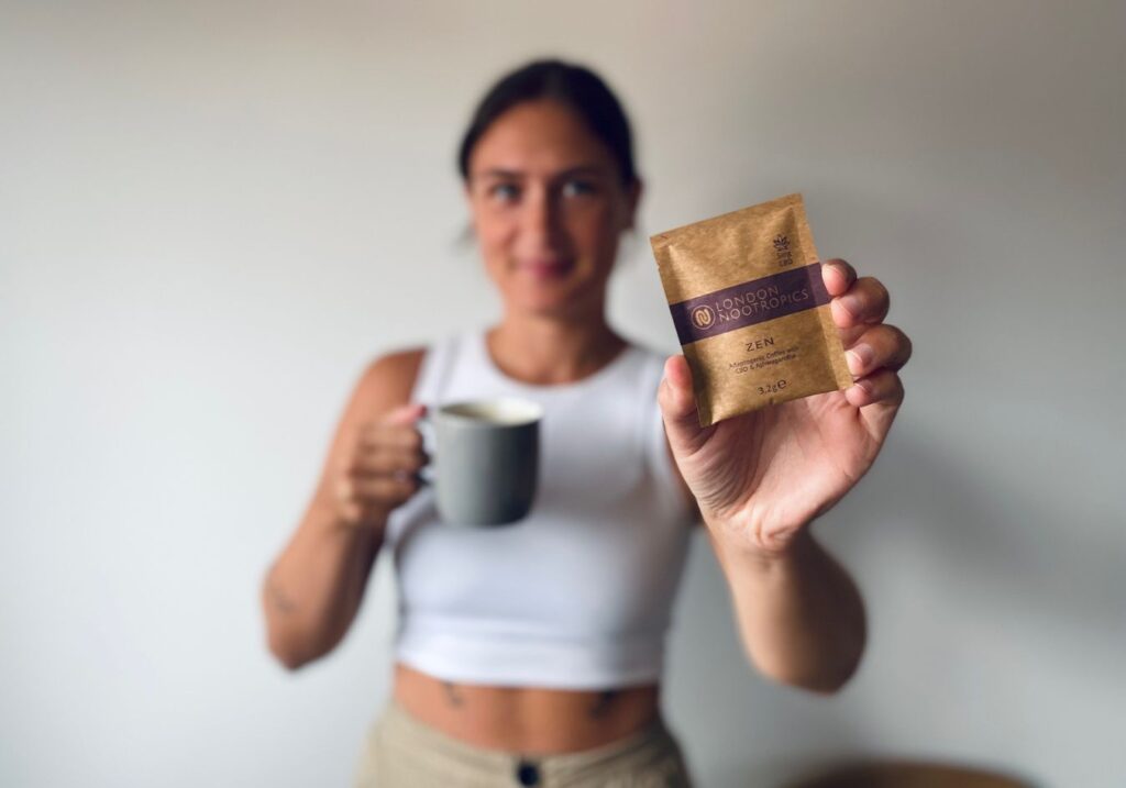 A sachet of Zen coffee being held up to the camera by Lucy that was tested for this London Nootropics review
