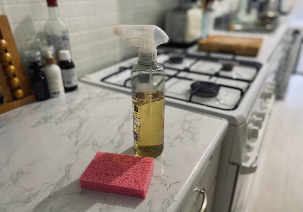 Some vegan cleaning products on a kitchen worktop