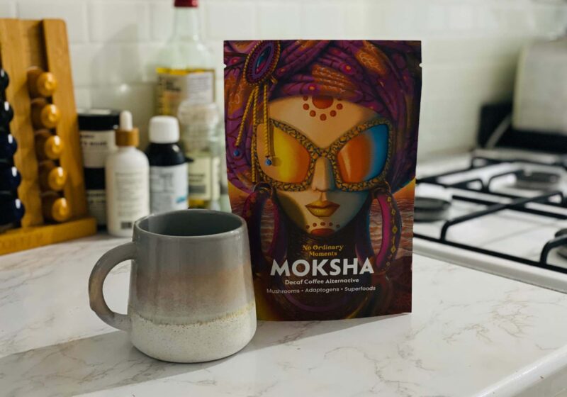 A bag of Moksha next to a mug - one of my favourite mushroom coffee blends