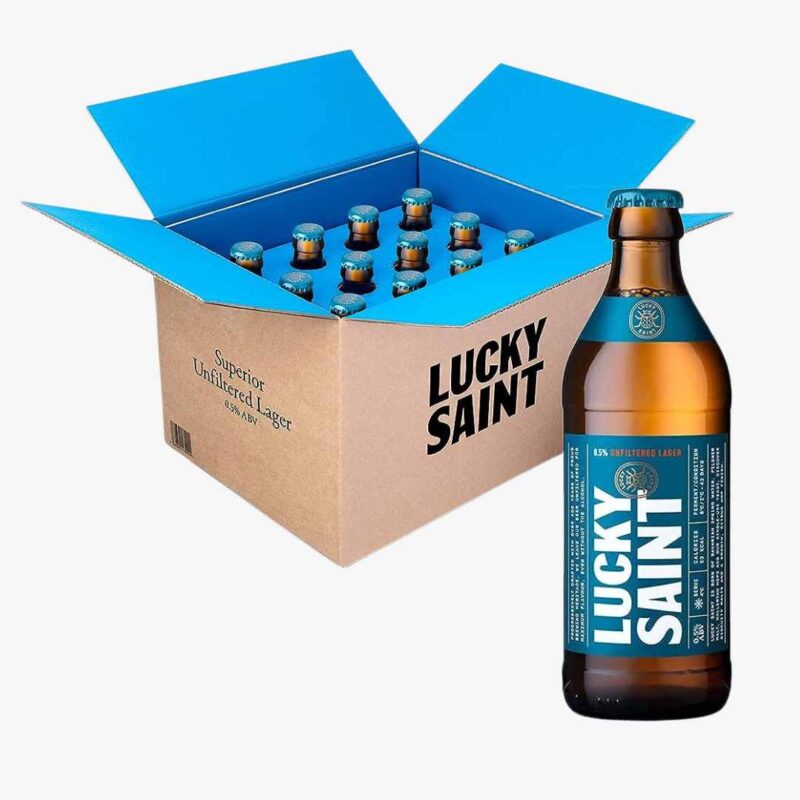 A bottle of Lucky Saint alcohol free beer in front of a box with more bottles