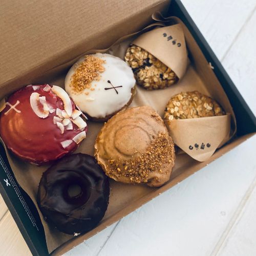 A box of Vegan Crosstown doughnuts - one of the best vegan cake delivery services in the UK