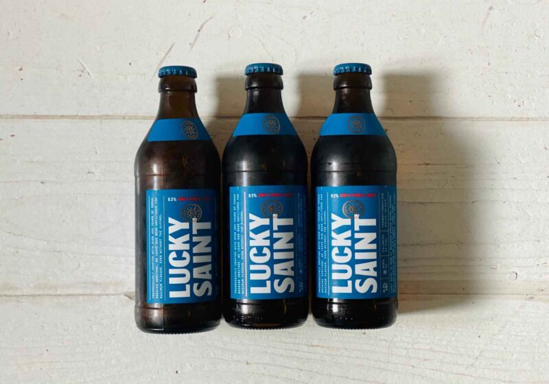 Three bottles of Lucky Saint alcohol-free beer ready to be reviewed