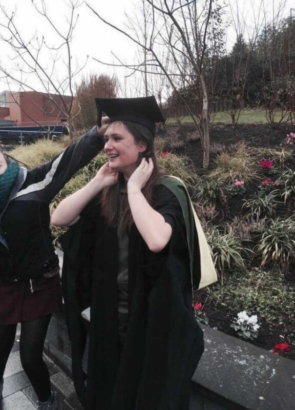 Lucy graduating from university where she studied politics and animal rights