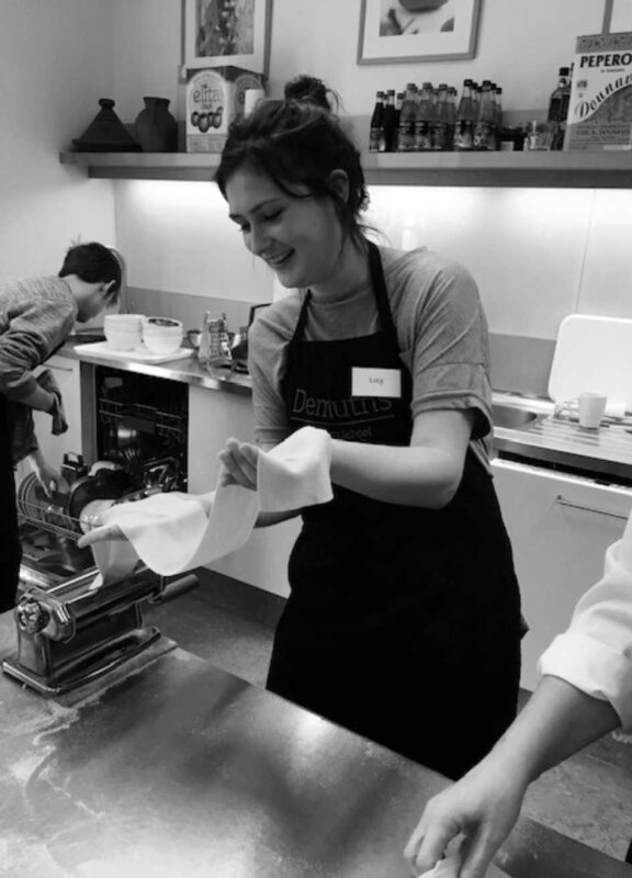 Lucy at a cooking course discovering her passion for food