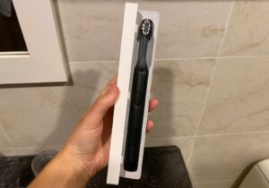 A Suri toothbrush inside the travel case which doubles up as a charger