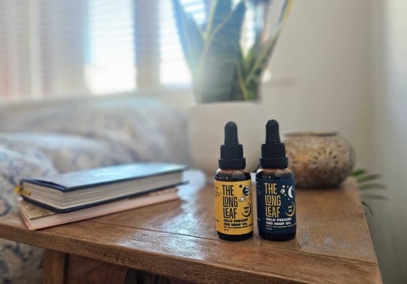 The two CBD oils from The Long Leaf on a bedside table