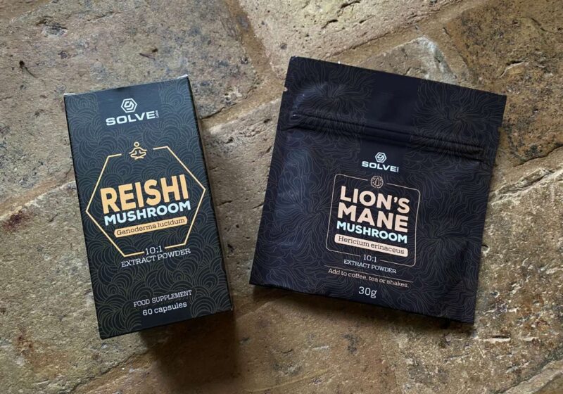 A bag of lion's mane powder next to a box of reishi supplements from Solve Labs